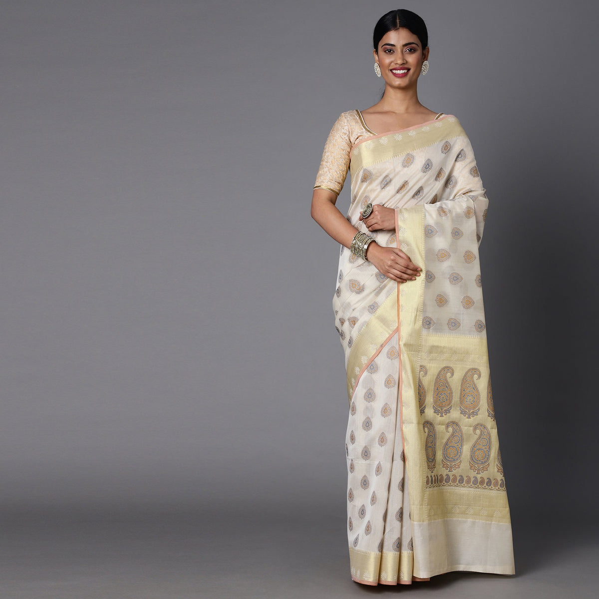 This Cream And Gold Contrast Hued Jacquard Saree Best For A Light Ocassion