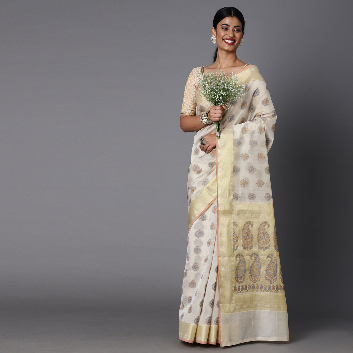 This Cream And Gold Contrast Hued Jacquard Saree Best For A Light Ocassion