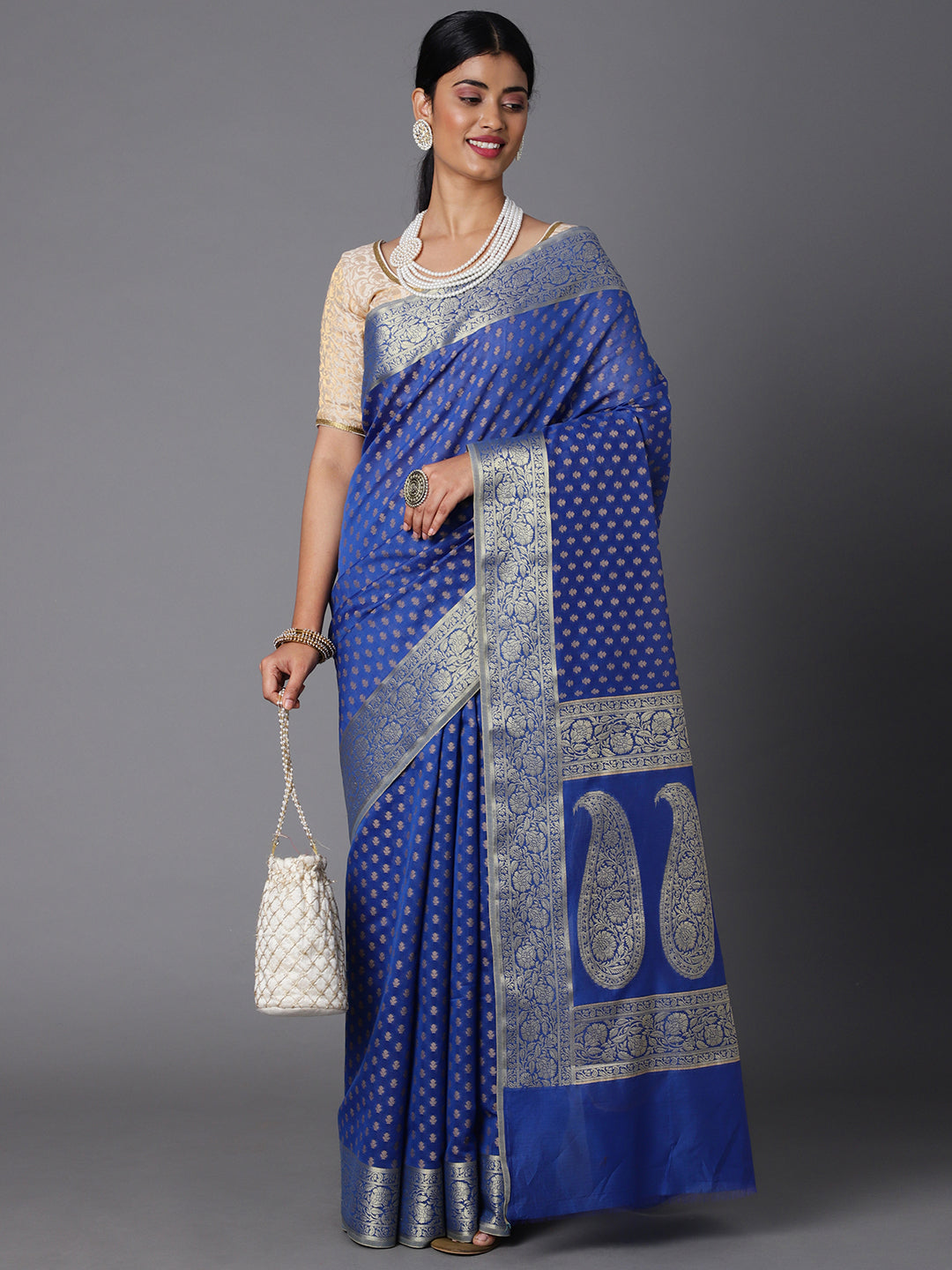 Features A Sheer Cotton Blend Saree With Jacquard Ethnic Buttis All Over