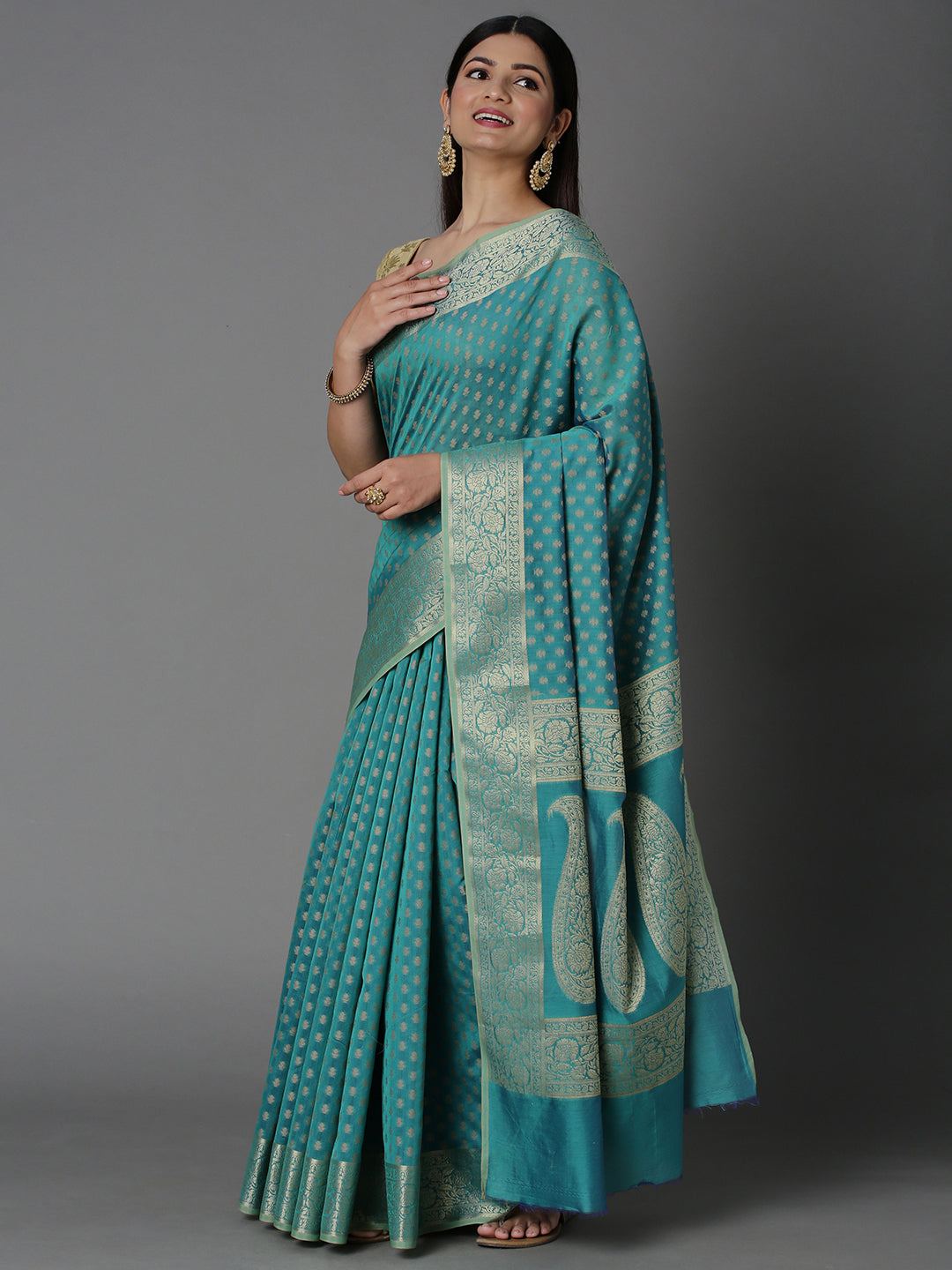 Features A Sheer Cotton Blend Saree With Jacquard Ethnic Buttis All Over