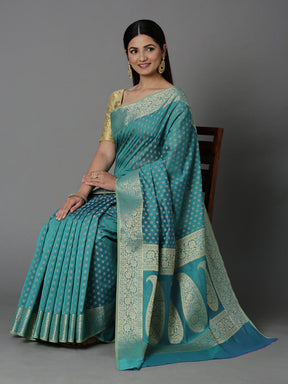 Features A Sheer Cotton Blend Saree With Jacquard Ethnic Buttis All Over