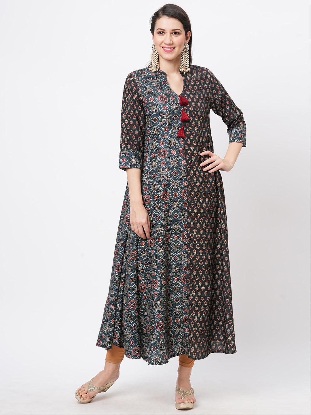 Forest Green Two Print Long Flared Kurta Complimenting Each Other With Contrast Color Tassel At The Neck.