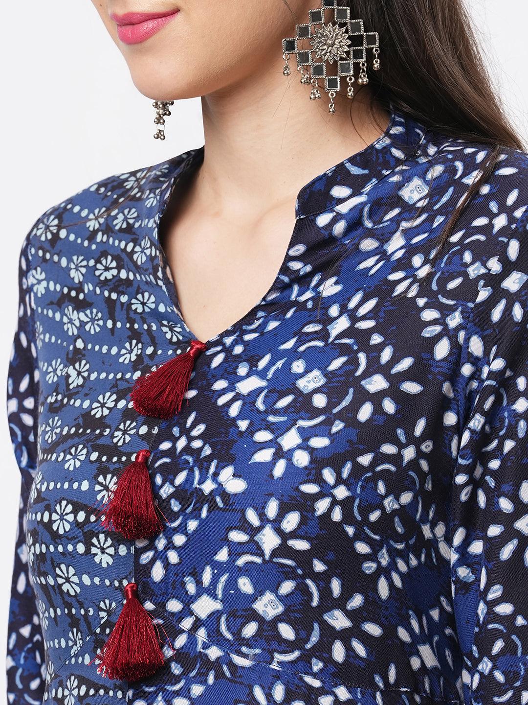 Indigo Two Print Long Flared Kurta Complimenting Each Other With Contrast Color Tassel At The Neck.