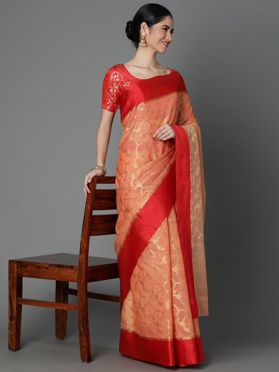 Features A Sheer Kota Saree With Texture And Circular Motif In Gold All Over