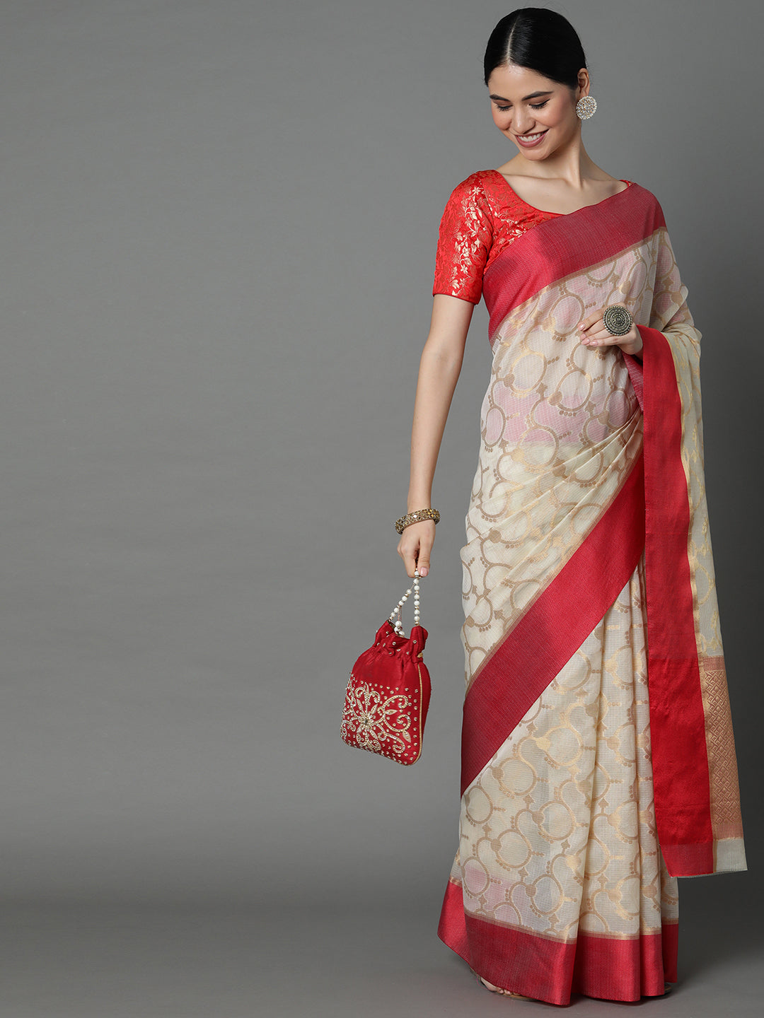 Features A Sheer Kota Saree With Texture And Circular Motif In Gold All Over