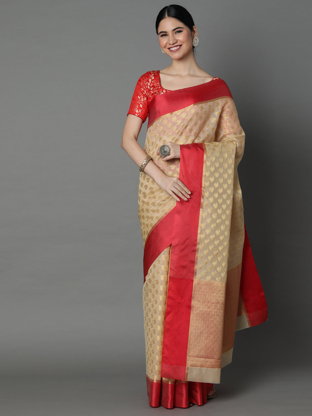 Features A Sheer Kota Saree With Texture And Buttis In Gold All Over