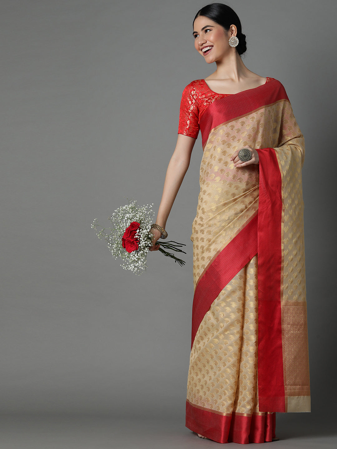 Features A Sheer Kota Saree With Texture And Buttis In Gold All Over