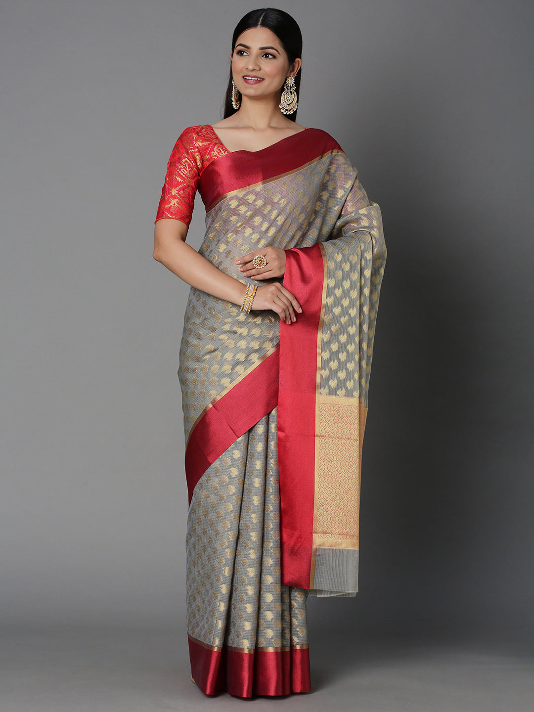 Features A Sheer Kota Saree With Texture And Buttis In Gold All Over