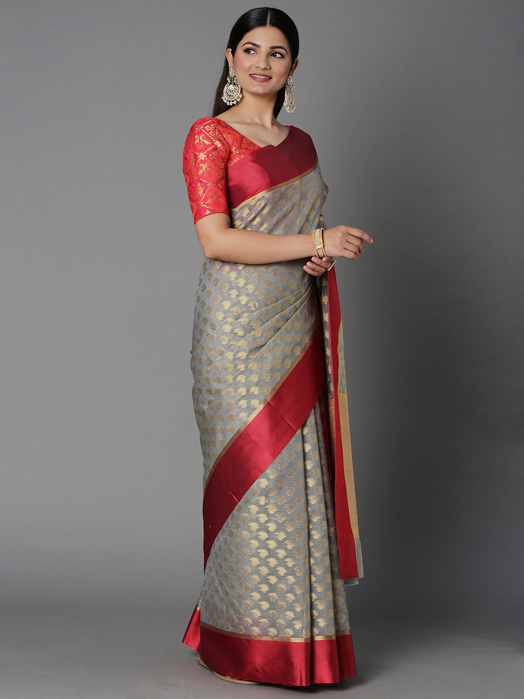 Features A Sheer Kota Saree With Texture And Buttis In Gold All Over