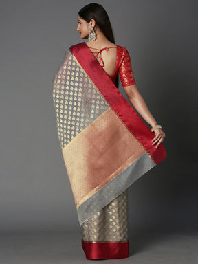 Features A Sheer Kota Saree With Texture And Buttis In Gold All Over