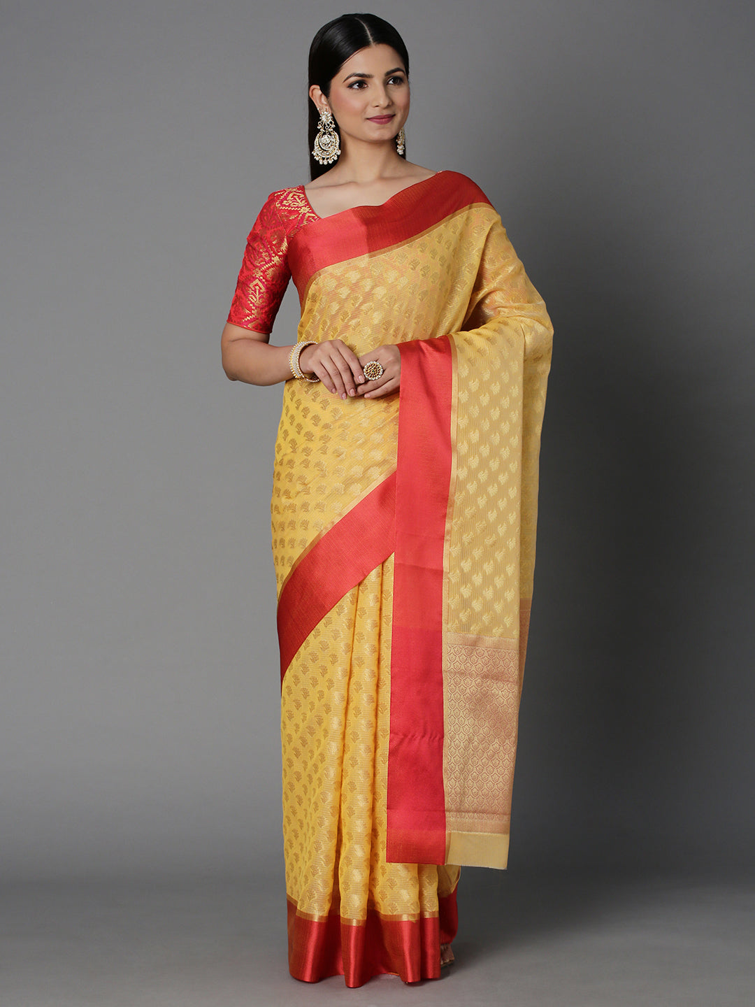 Features A Sheer Kota Saree With Texture And Buttis In Gold All Over