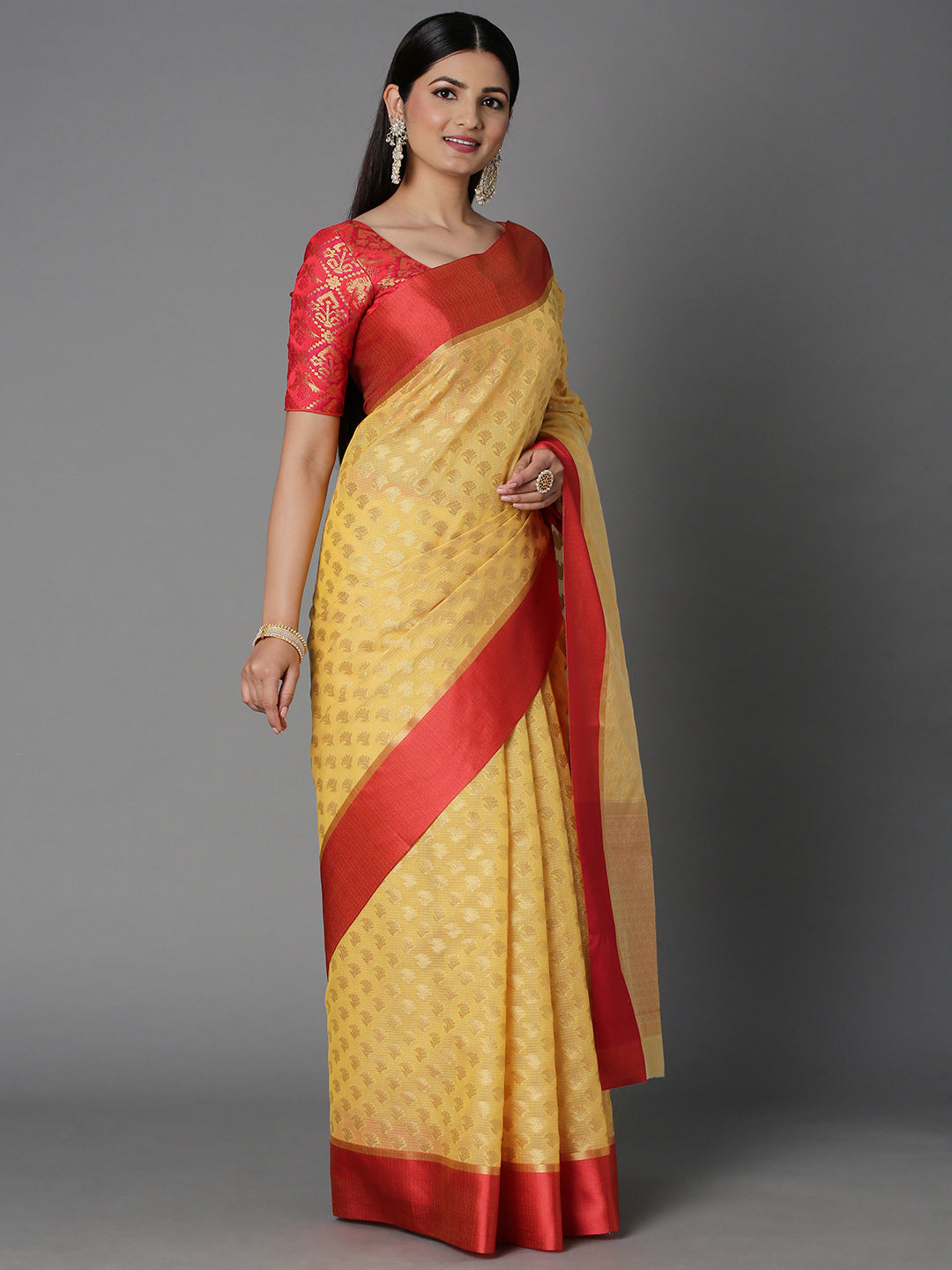 Features A Sheer Kota Saree With Texture And Buttis In Gold All Over