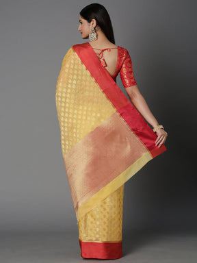 Features A Sheer Kota Saree With Texture And Buttis In Gold All Over