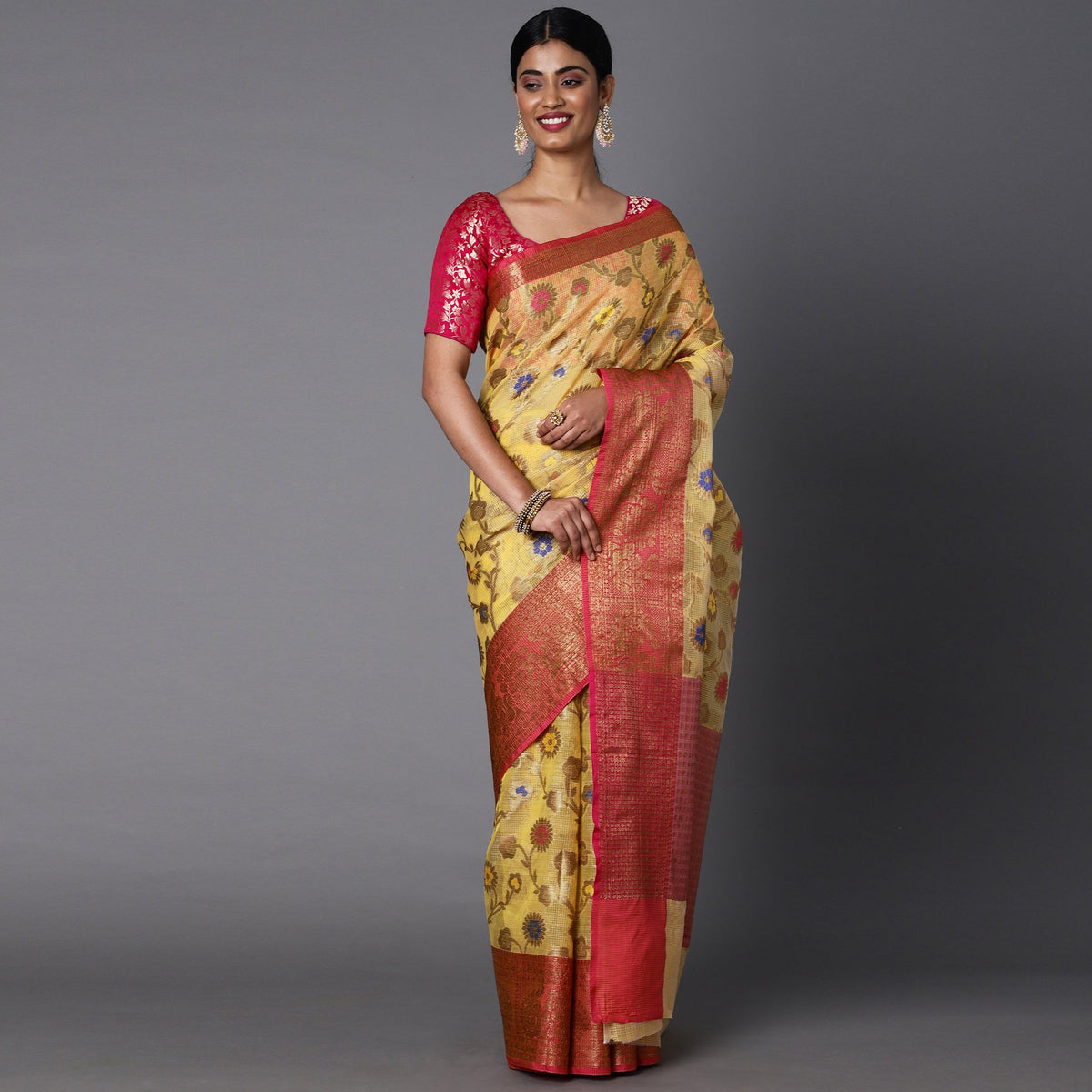 Featuring A Sheer Lemon Saree With Multi Colored Floral Motifs All Over