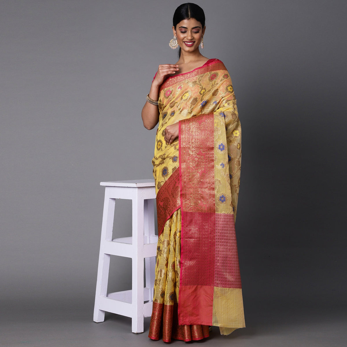 Featuring A Sheer Lemon Saree With Multi Colored Floral Motifs All Over