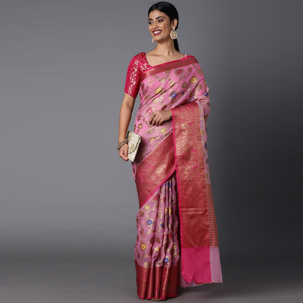 Featuring A Sheer Light Pink Saree With Multi Colored Floral Motifs All Over