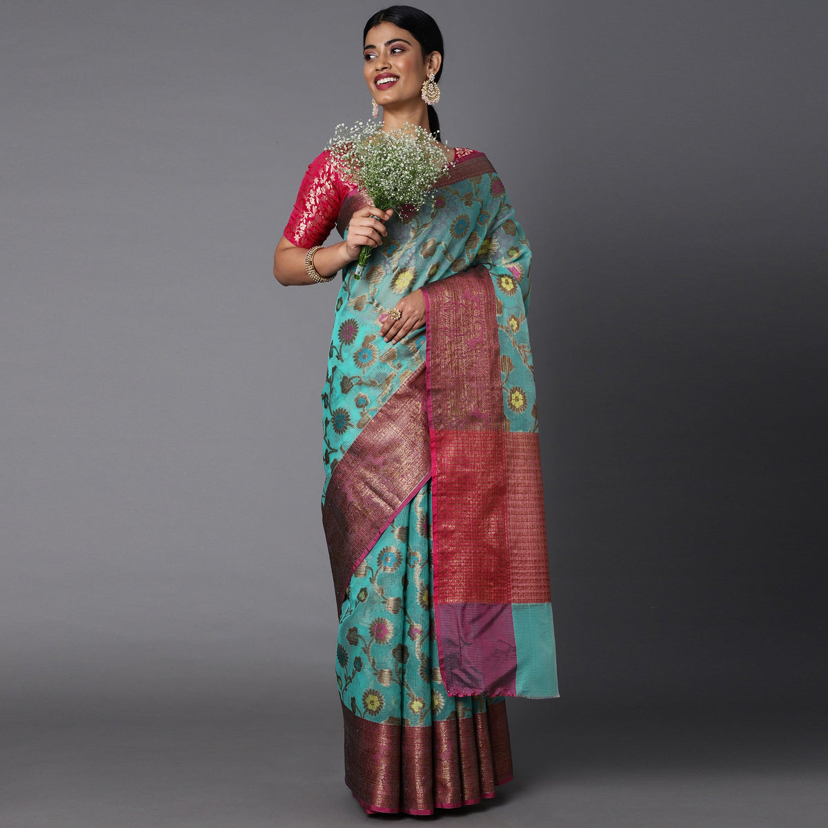 Featuring A Sheer Seagreen Saree With Multi Colored Floral Motifs All Over