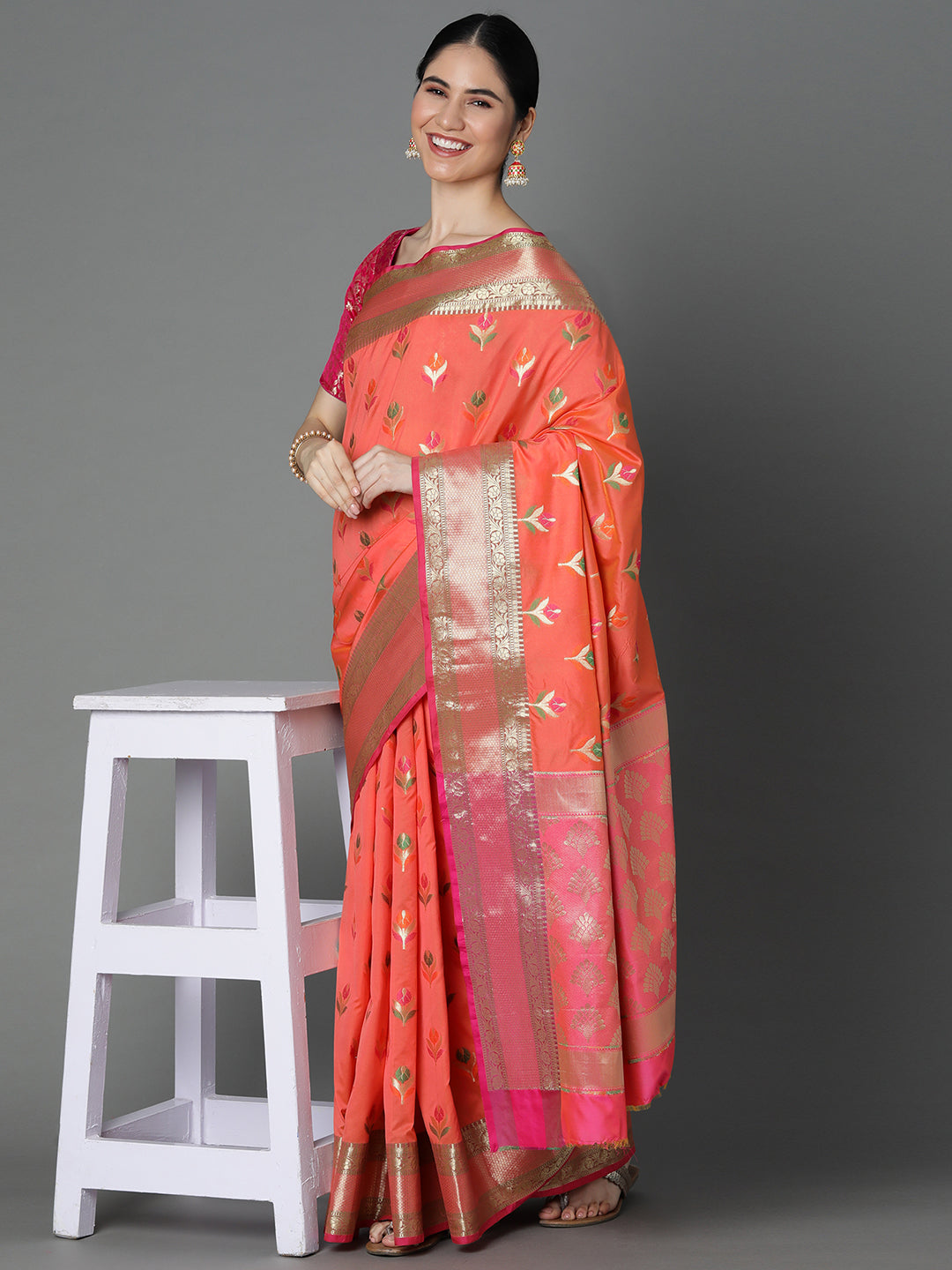 Features A Radiant Silk Blend Saree With Jacquard Ethnic Buttis All Over