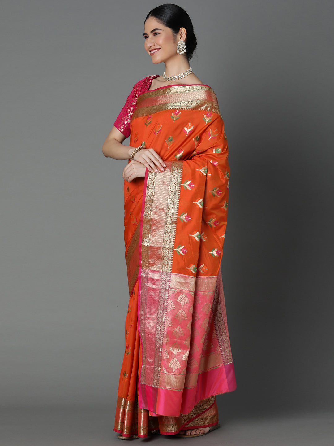 Features A Radiant Silk Blend Saree With Jacquard Ethnic Buttis All Over