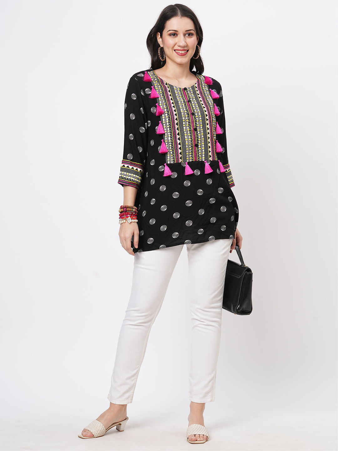 Boho-Chic Black Printed Tunic With Contrast Embroidered Linear Yoke And Fuschia Pink Tassels