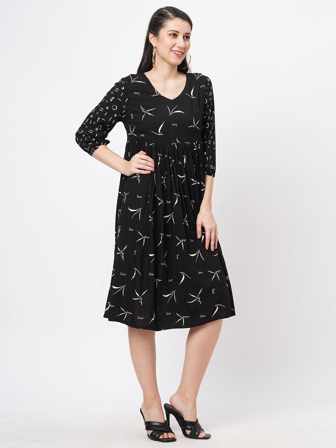 Featuring A Wide Black Dress With Gathers And Sleeves In Complimenting Print