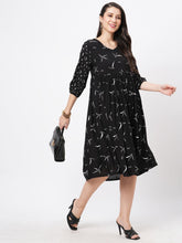 Featuring A Wide Black Dress With Gathers And Sleeves In Complimenting Print